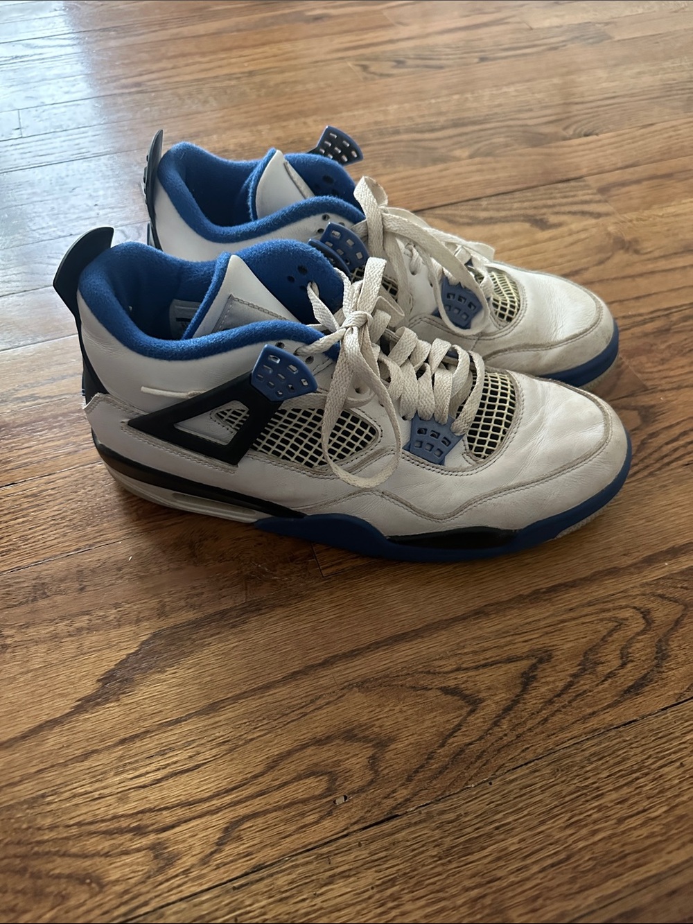 Air Jordan 4 Retro "Motorsports" White and Blue Retro Basketball Sneakers.